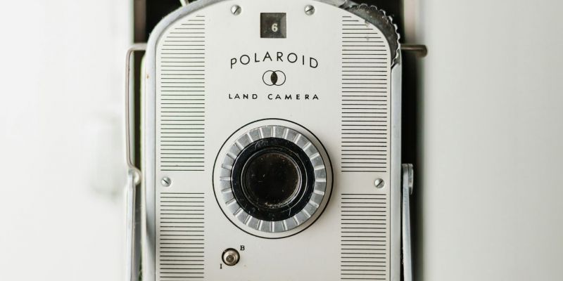 Close-up of a vintage Polaroid Model 800 camera with a white and silver faceplate, captured as part of the VERVE Columbia lifestyle series