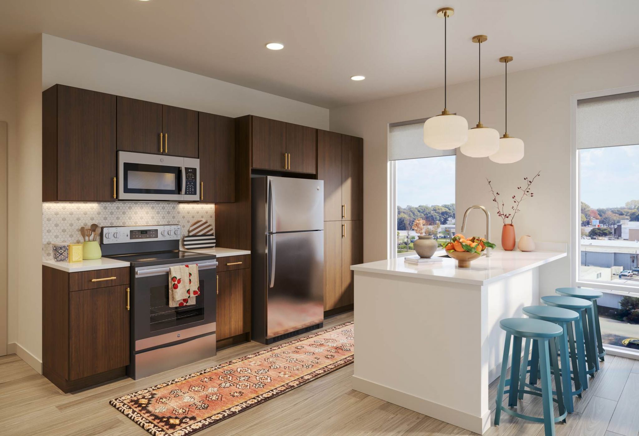 VERVE Columbia student apartments kitchen rendering with stainless steel appliances and a kitchen island